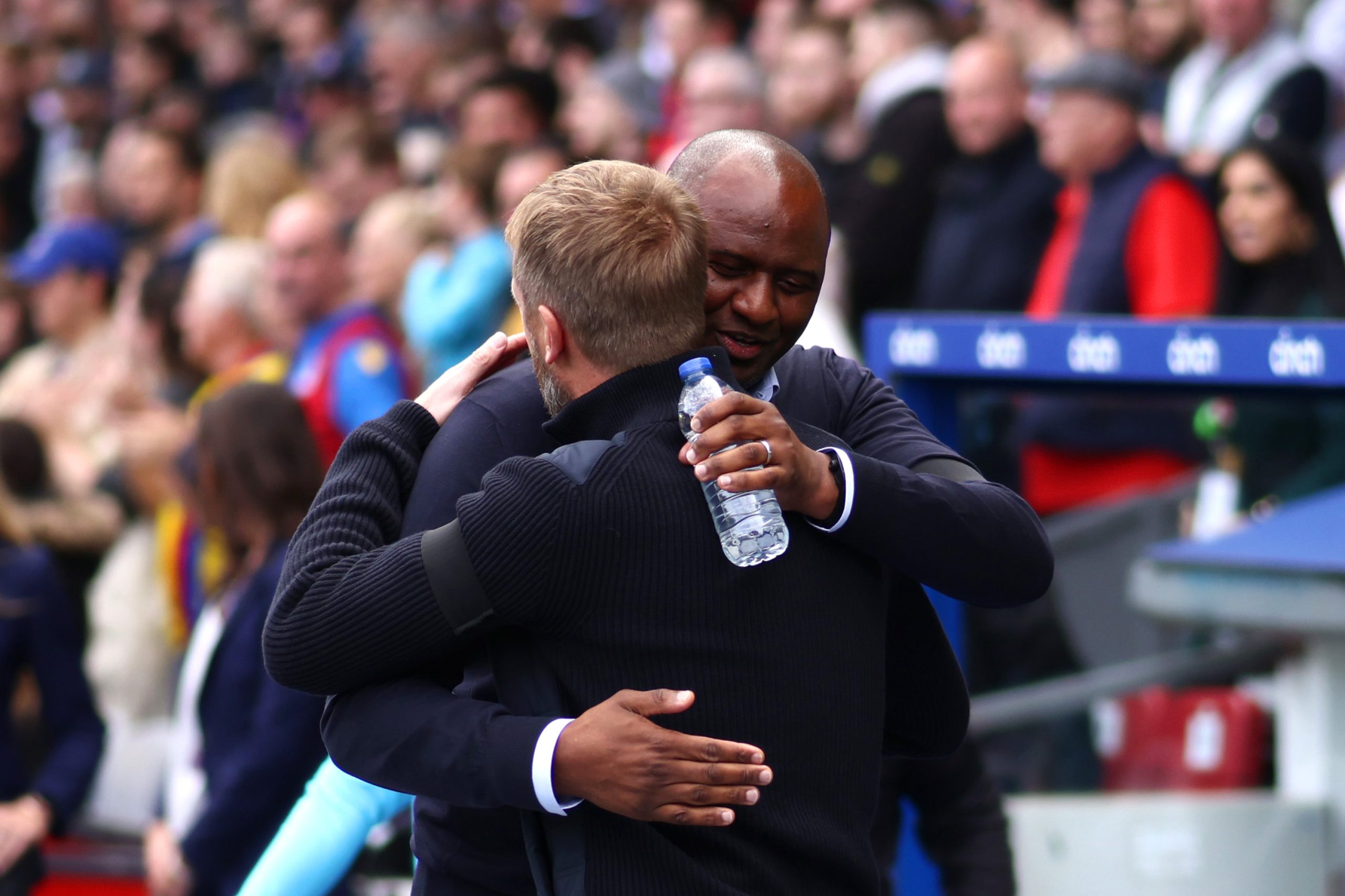 Chelsea manager, Graham Potter, embraces Crystal Palace's Patrick Vieira.