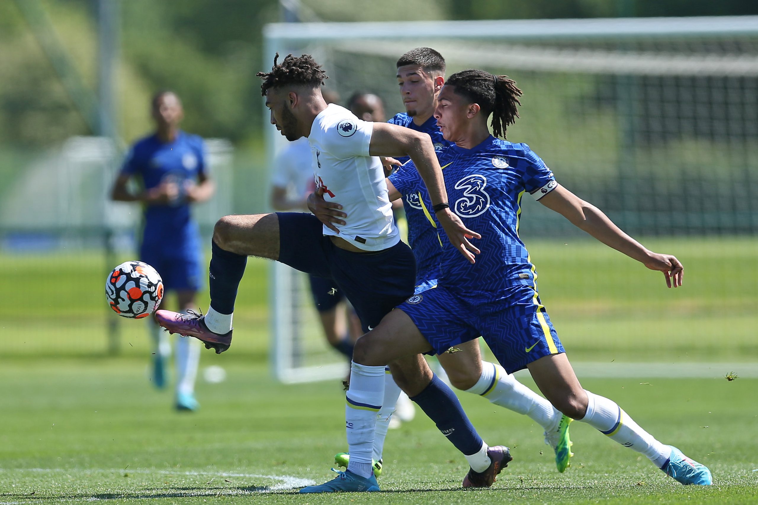 Kion Etete of Tottenham Hotspur U23 challenges for the ball with Bashir Humphreys of Chelsea U23.