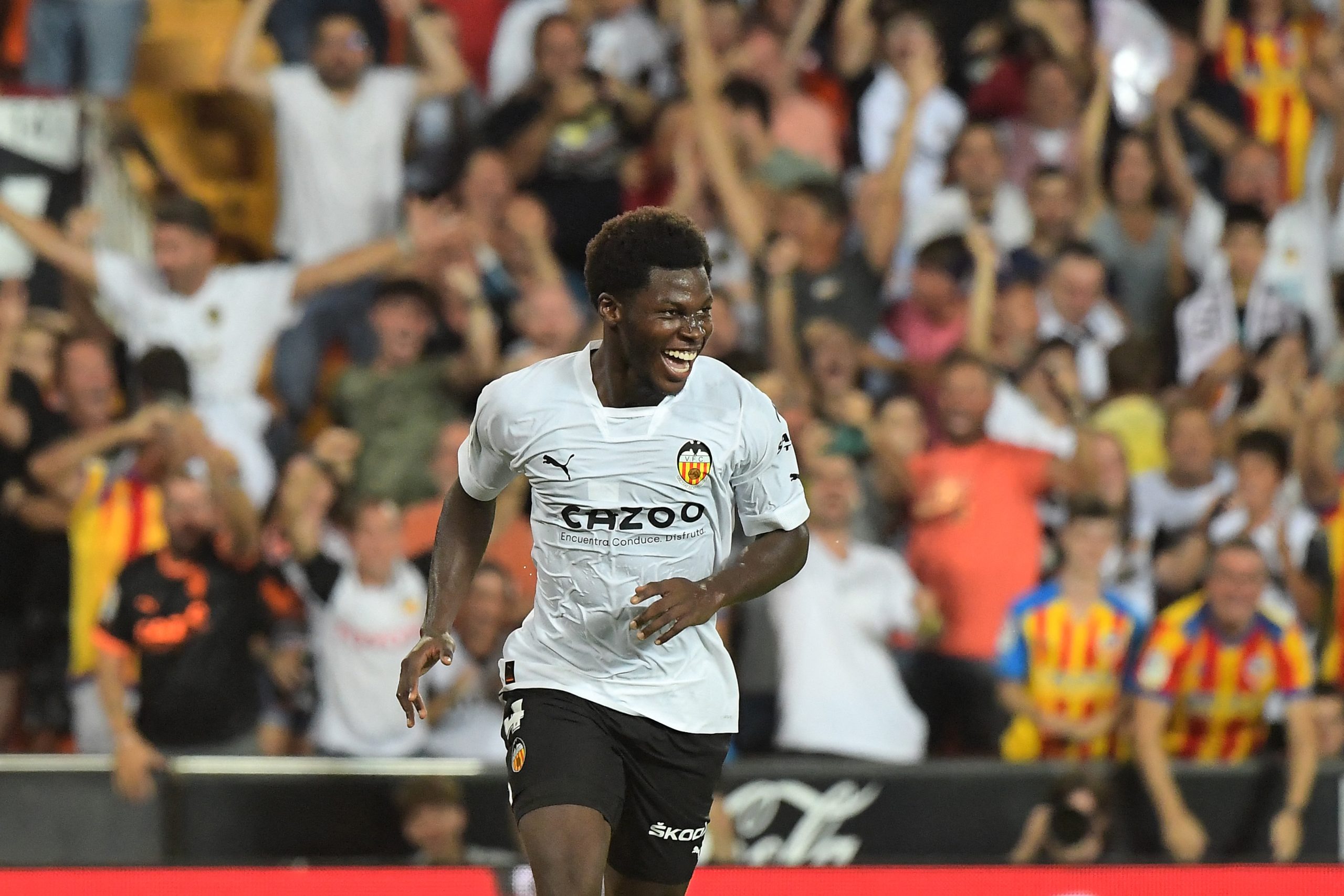 Valencia's US midfielder Yunus Musah celebrates a goal.