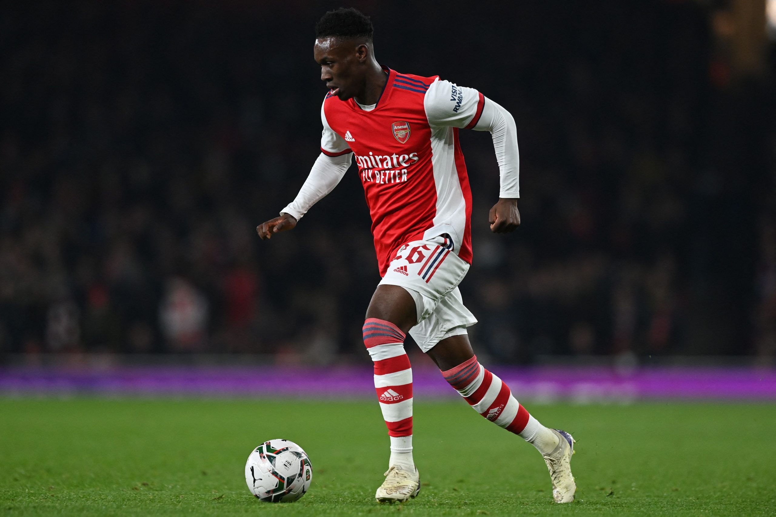 Arsenal's English striker Folarin Balogun runs with the ball.